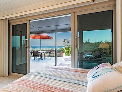 view of the beach from the bed